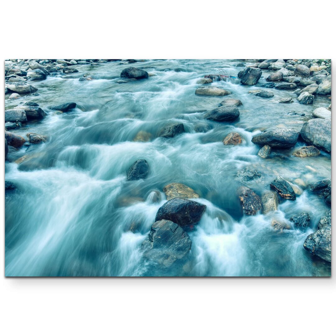 Leinwandbild Flussströmung zwischen Steinen