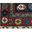 Seychour Wool Oriental Area Rug in Green/Red