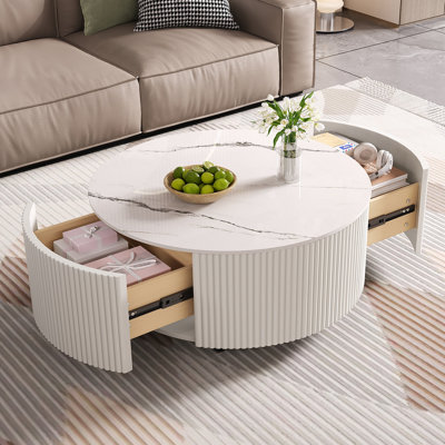 Table basse ronde moderne et fonctionnelle avec roulettes et deux tiroirs, idéale pour divers espaces de vie et décors