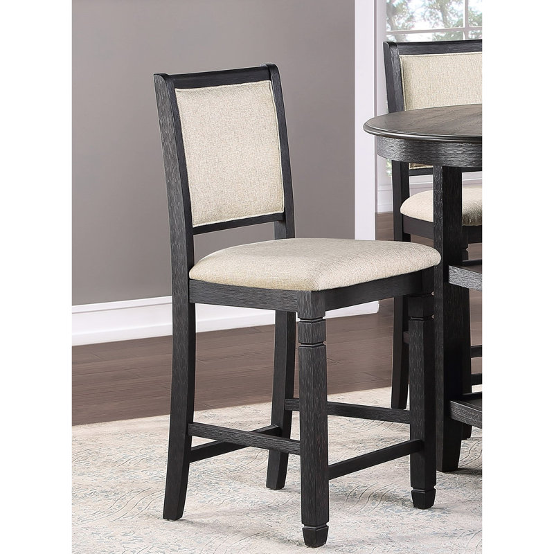 2 chaises à hauteur de comptoir, structure en bois au fini noir et assise en tissu d'ameublement texturé beige