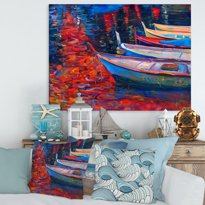 Bateaux qui se reposent sur l'eau pendant un coucher de soleil chaud - Peinture sur toile