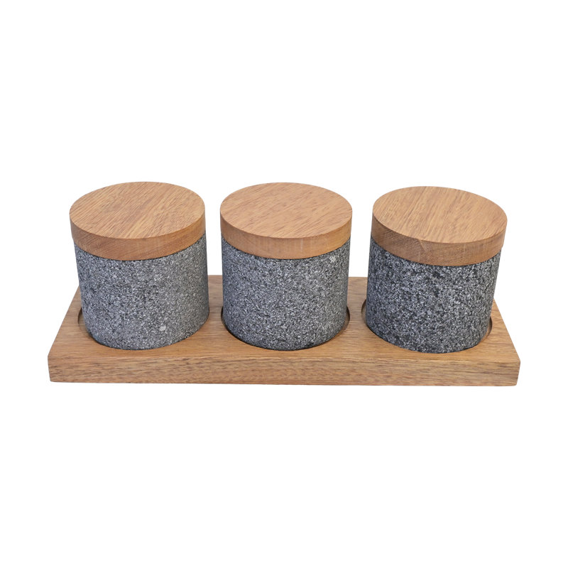 Boîtes en pierre volcanique avec couvercles et base en bois