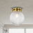Gruste Brass Flushmount Ceiling Lamp With Pyramidical Patterned Glass Globe Shade