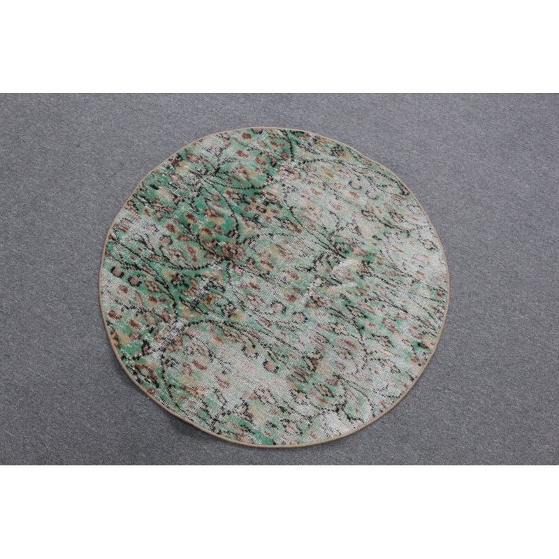 Tapis rond rond d'inspiration turque vert parfait pour une petite entrée ou un vestibule