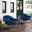 Fauteuil à bascule avec coussin bleu marine, structure en acier et siège rembourré pour une utilisation à l'extérieur -