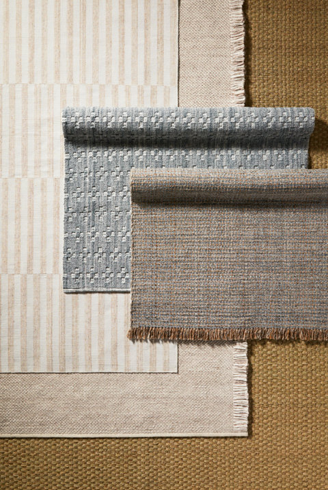 Various indoor area rugs with different patterns and textures.