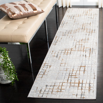 Tapis gris / doré à motif abstrait Kornegay