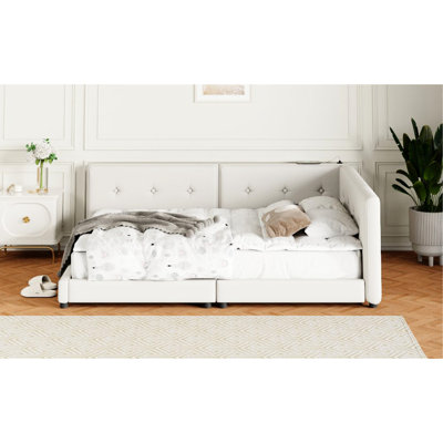 Grand lit tapissier beige avec apparence élégante et design de construction