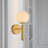 Andreane Opaque Globe Sconce