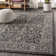 Markwart Vine and Border Textured Weave Black/Gray Indoor/Outdoor Rug