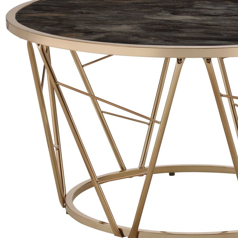 Table basse ronde en faux marbre et verre en noir et champagne
