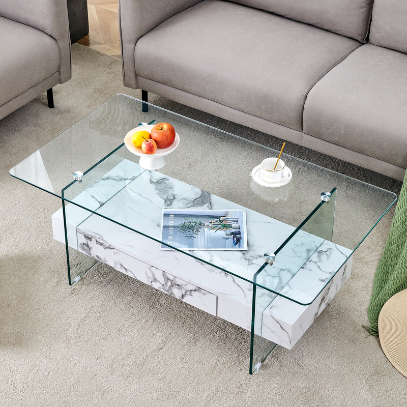 Table basse moderne à deux niveaux - verre trempé transparent et texture de marbre blanc, design de rangement multifonctionnel. L'étage inférieur comprend un tiroir. Peut être utilisé comme table basse, table d'appoint, etc.