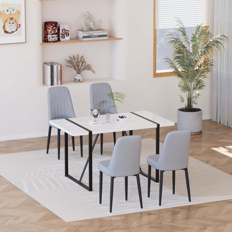 Ensemble de table de salle à manger 55 po en MDF moderne pour 4 personnes, ensemble de table et de chaises avec pieds en métal noir pour cuisine, plateau de table rectangulaire blanc industriel et chaises de salle à manger rembourrées en polyuréthane épais