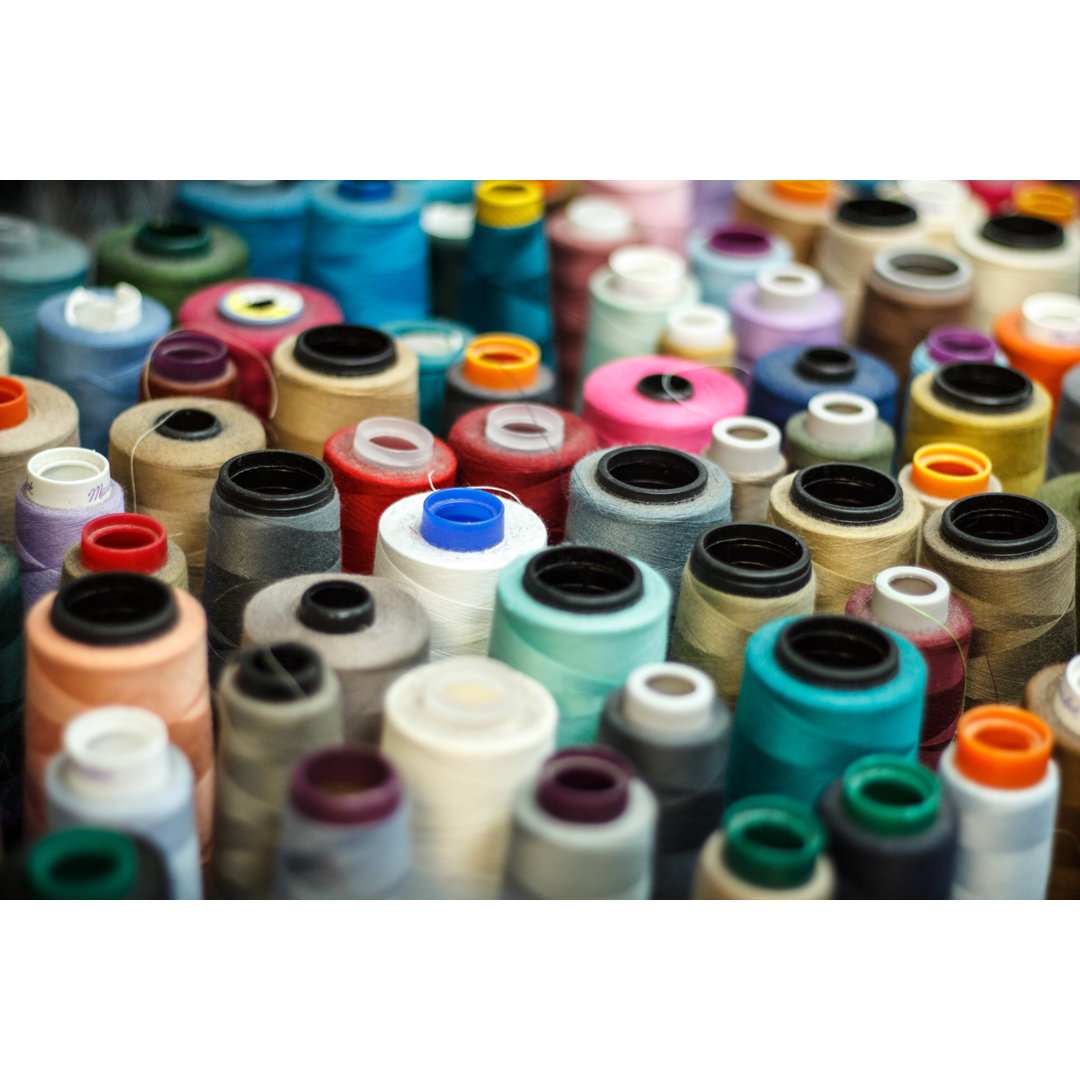 Rolls of Threads by Istockstudioguy - Leinwandfoto