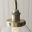 Anais 3lt Linear Pendant light finished in Ant. Brass