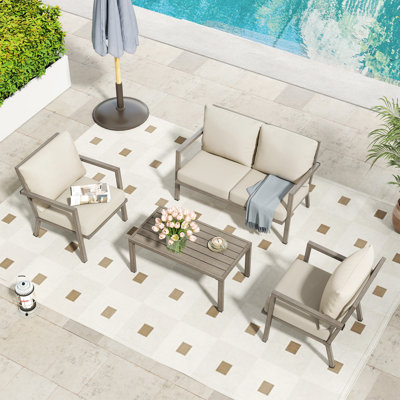 Ensemble de conversation d'extérieur en aluminium 4 pièces avec coussin beige, causeuse et table basse Heim