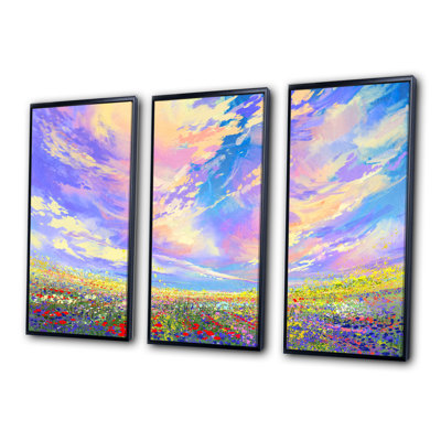 Fleurs colorées dans un champ sous de magnifiques nuages - ensemble d'art mural sur toile traditionnel encadré de 3
