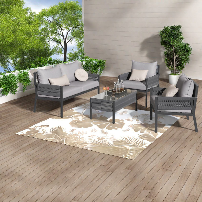 Ensemble de salle à manger de patio durable 4 pièces avec table en verre trempé, style boho pour le divertissement dans la cour