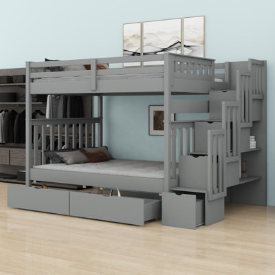 Bunk Bed Featuring Built In Shelves And Multiple Storage Drawers