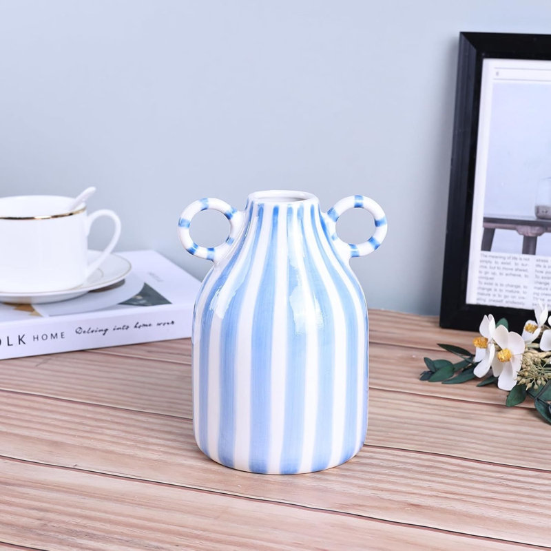 Petit vase décoratif en céramique rayé noir et blanc