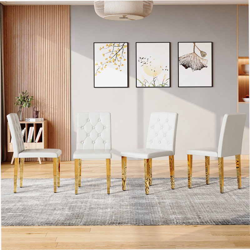 Ensemble de 4 chaises de salle à manger en polyuréthane blanc: dossier à boucle ergonomique, hauteur de 35 pouces, pieds en métal noir, combinant confort et texture. Parfaitement adapté aux salles à manger familiales, aux salles de banquet d'hôtel, etc.