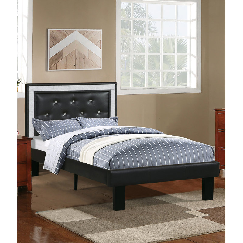 Lit simple glamour avec tête de lit capitonnée à motif de losanges et pieds de soutien centraux, revêtement en similicuir