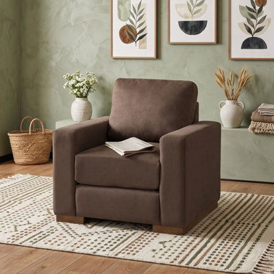 Fauteuil rembourré avec piètement en bois