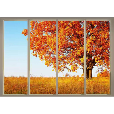 Arbre solitaire en automne sur un champ