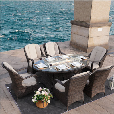 Carshalt 7 Piece Dining Set with Cushions and Firepit