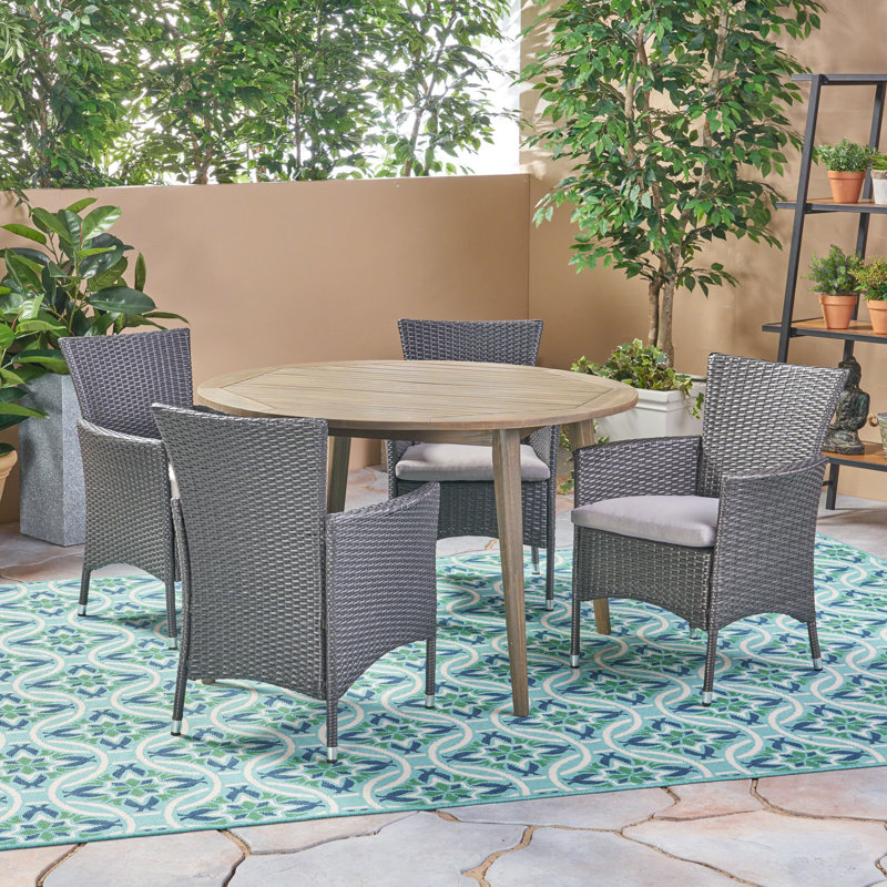 Cambriah 4 - Person Acacia Solid Wood Patio Dining Set Round Table with Cushions Included, Gray Frame / Silver Cushion