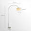 Lampe sur pied moderne minimaliste, abat-jour en tissu et base en métal argenté.
