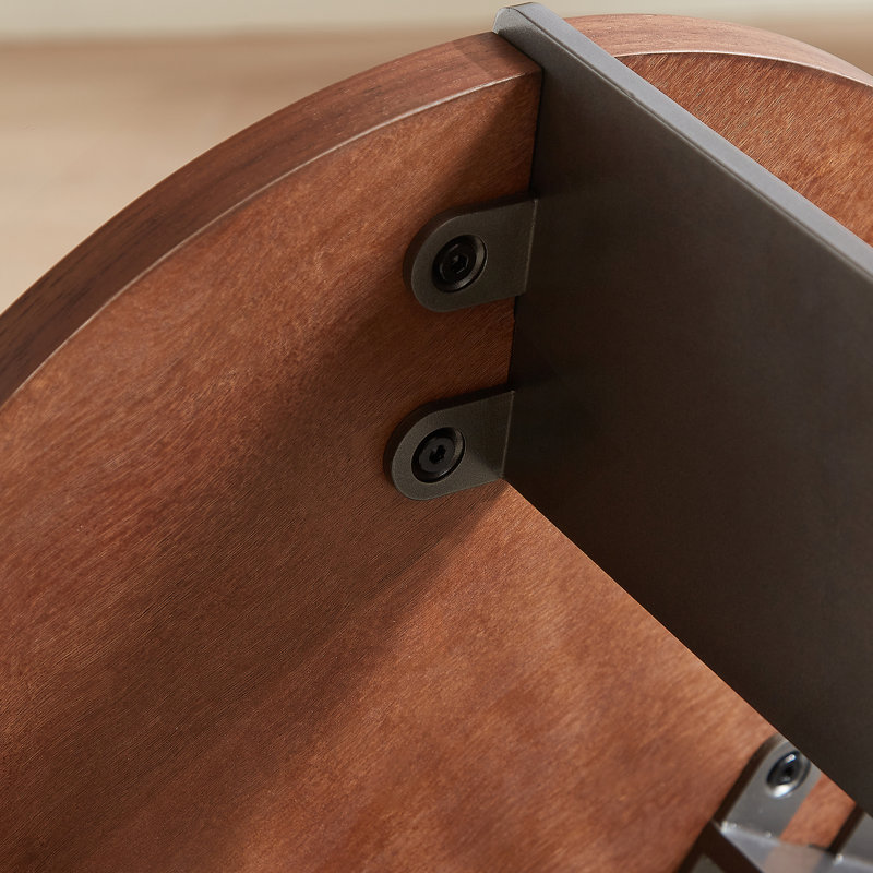 Table basse ronde en bois de noyer et pieds en métal