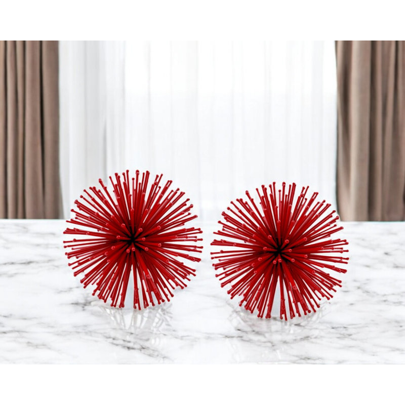 Ensemble de deux sculptures de table sphériques en fer rouge