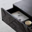 Table basse noire sculptée-110476767