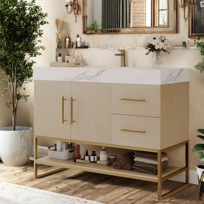 Meuble-lavabo spacieux et moderne avec lavabo en céramique, détails dorés