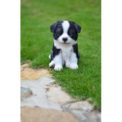 Statue d'un border collie assis