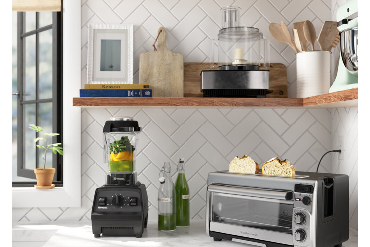 kitchen with open shelving that houses a food processor and a blender