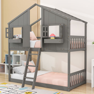 Lit superposé simple au-dessus d'un lit simple en bois avec boîte de rangement, garde-corps et échelle