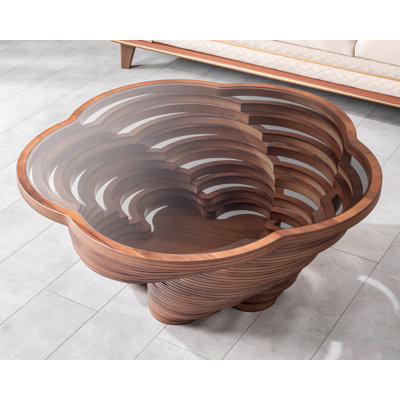 Queen Sculptural Coffee Table with Smoked Glass Top, Layered Walnut Veneer Design