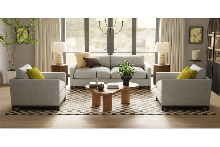 How to decorate a long narrow living room with a gray loveseat and two gray accent chairs and large window