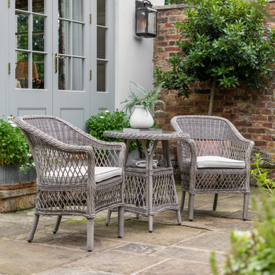 Cassara 2 - Person Wicker Patio Dining Set with Round Table , Cushions Included