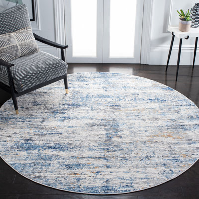 Tapis abstrait ivoire / bleu Adalee