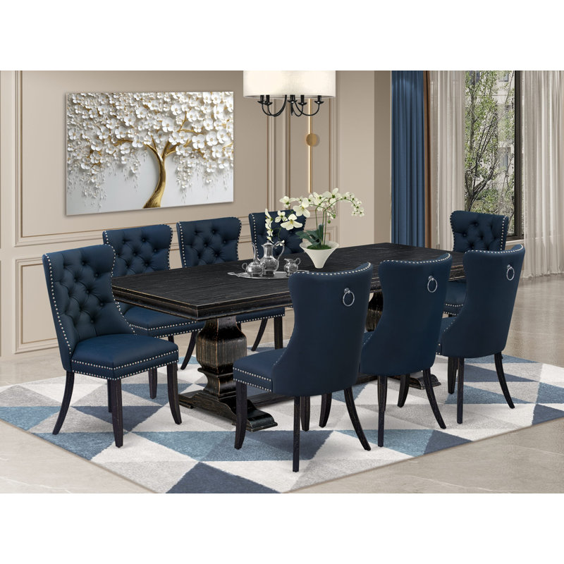 L'ensemble de table de cuisine 9 pièces comprend une table rectangulaire et 8 chaises parsons en tissu en polyester bleu marine avec dossier capitonné à boutons - finition noir sablé.