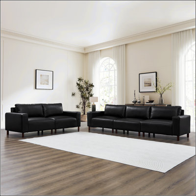 Canapé de luxe en similicuir rembourré avec pieds en bois pour salon et appartement