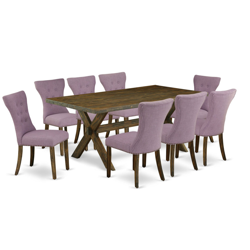 L'ensemble de table de salle à manger 9 pièces comprend une table de salle à manger rectangulaire avec des pieds en X et 8 chaises Parson rembourrées en tissu Dahlia, finition jacobine patinée.