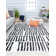 Tapis blanc pluie Graham Bennett