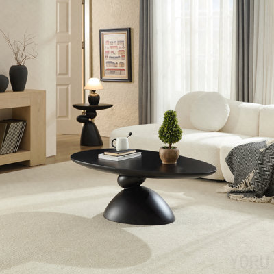 Table basse elliptique en forme de pierre Lucky, design minimaliste moderne avec base sculpturale pour petits espaces, noir