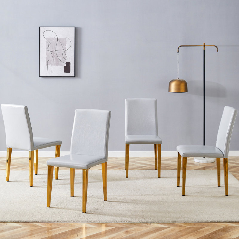 4 chaises de salle à manger en polyuréthane gris - élégantes et confortables, avec des pieds en métal robustes et 4 chaises confortables