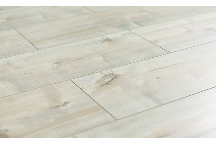 Light gray laminate flooring that looks like planks of natural wood