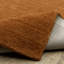 Tapis en laine rouille unie Makhari-1003433167